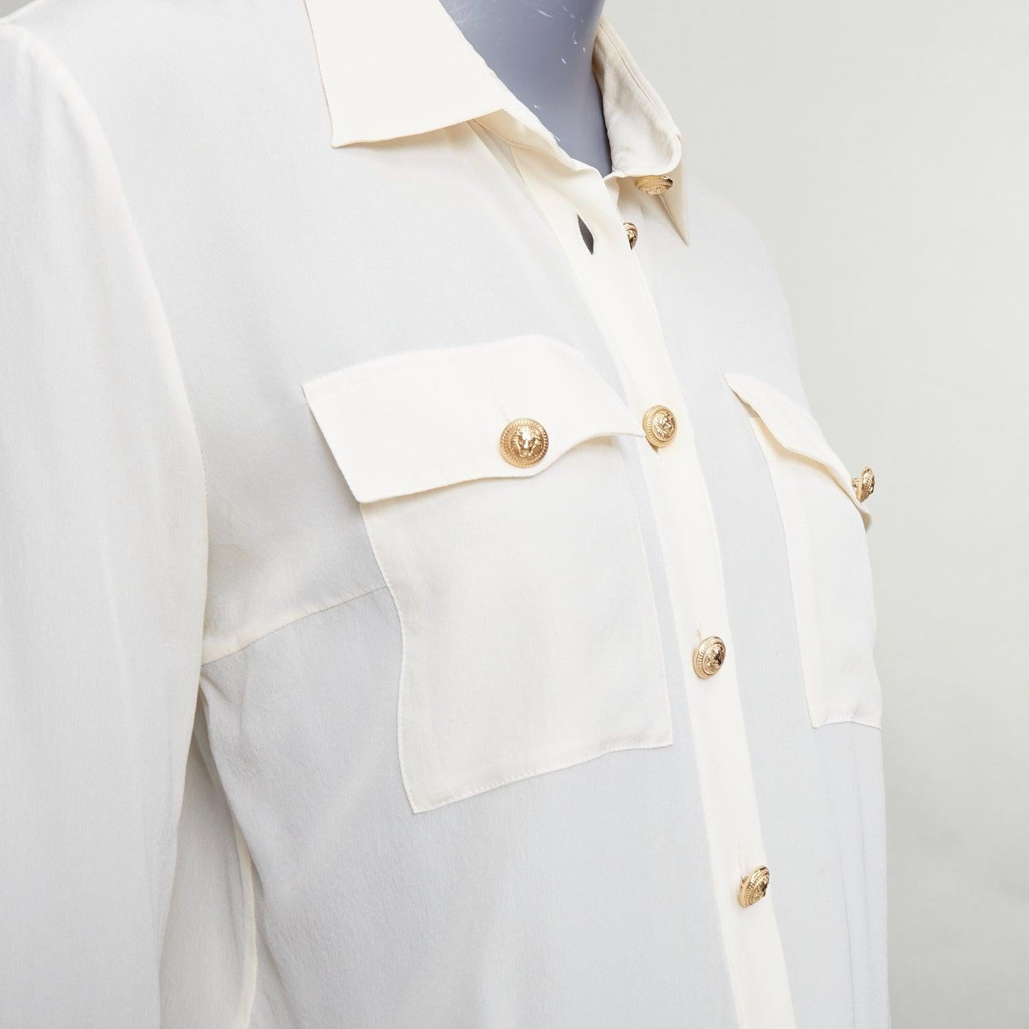 BALMAIN cream 100% silk gold buttons pocketed military blouse FR36 S
Reference: GEGG/A00145
Brand: Balmain
Designer: Olivier Rousteing
Material: Silk
Color: Cream, Gold
Pattern: Solid
Closure: Button
Extra Details: Buttoned