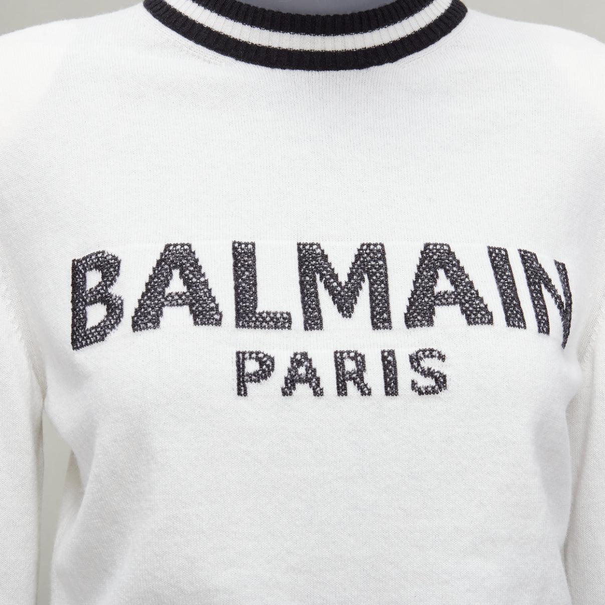 BALMAIN cream black wool cashmere logo padded shoulder sweater FR34 XS
Reference: AAWC/A00817
Brand: Balmain
Designer: Olivier Rousteing
Collection: AW21
Material: Wool, Cashmere, Blend
Color: Cream, Black
Pattern: Solid
Closure: Pullover
Extra