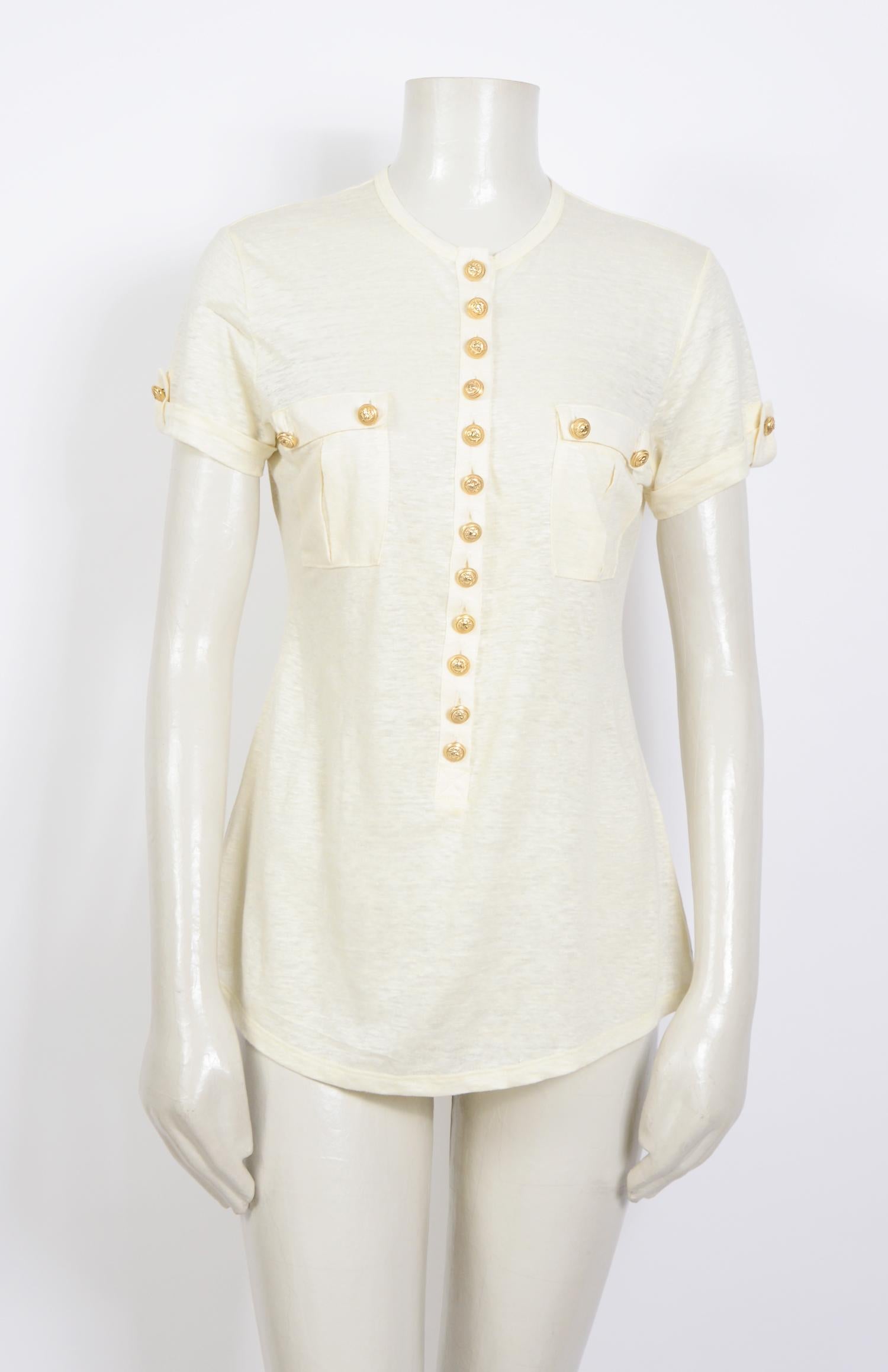 This short sleeve tee by Balmain made in pure cream linen is highlighted by embossed golden buttons for a military feel - a signature aesthetic of the brand.
Made in France - French size 36 - Twin chest pockets
Measurements are taken flat:
Ua to Ua