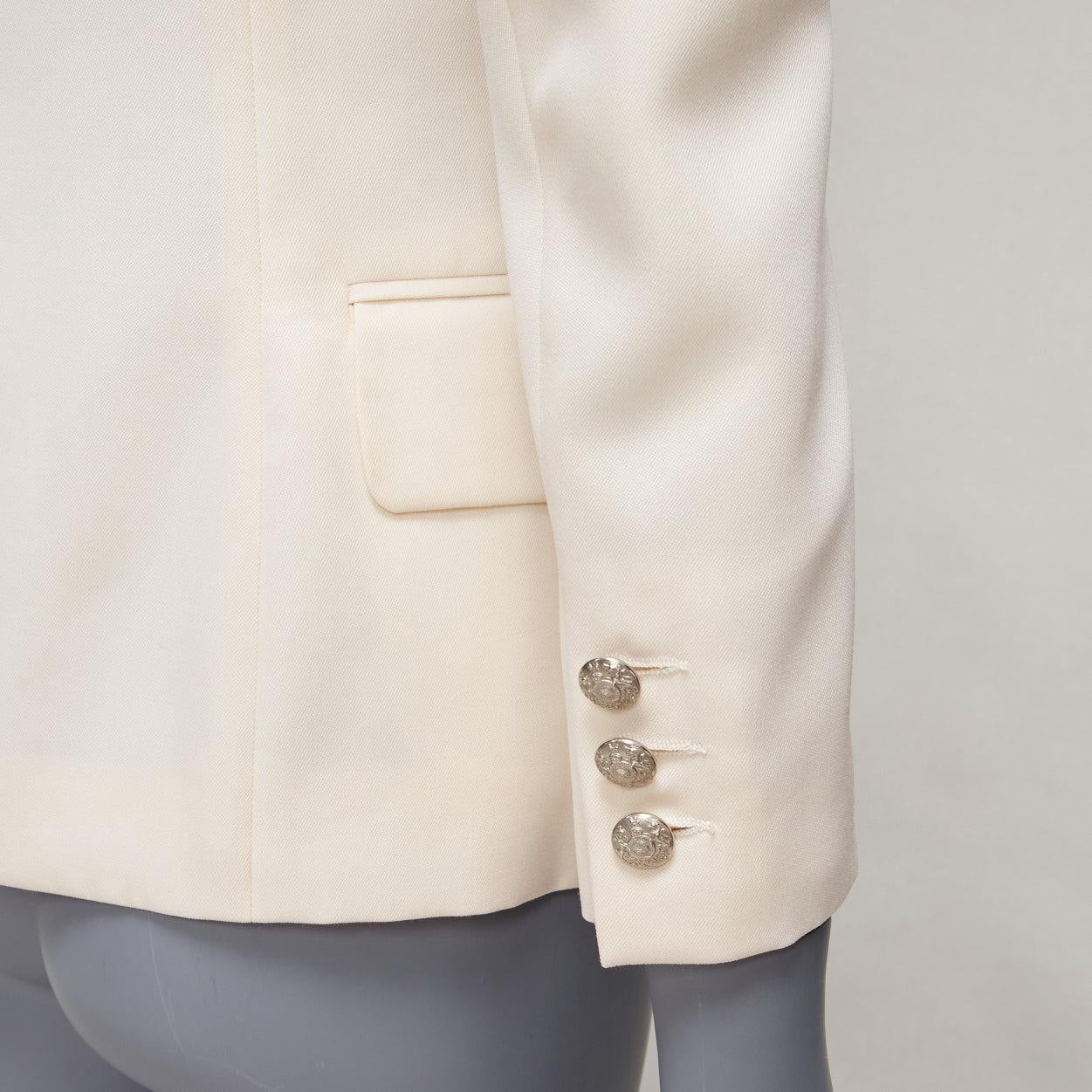 BALMAIN cream pagoda peak power shoulder single button tuxedo jacket FR38 S
Reference: NKLL/A00177
Brand: Balmain
Designer: Olivier Rousteing
Material: Wool
Color: Cream
Pattern: Solid
Closure: Button
Lining: White Viscose
Extra Details: Strong