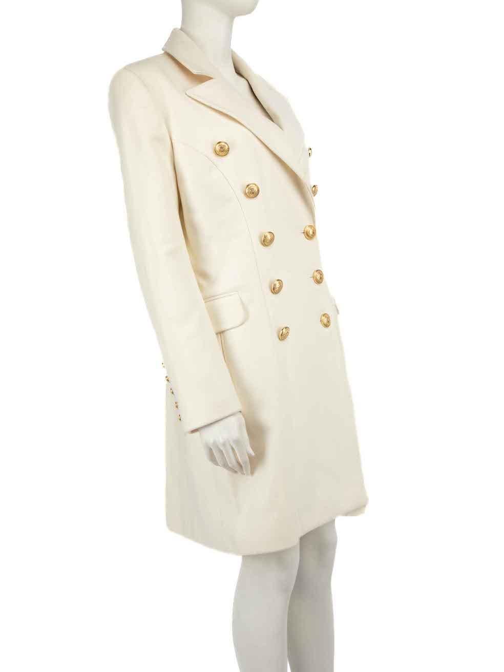 CONDITION is Never worn, with tags. No visible wear to coat is evident on this new Balmain designer resale item.
 
Details
Cream
Wool
Mid length coat
Double breasted with logo buttons
Buttoned cuffs
2x Front side pockets with flaps

Made in Poland
