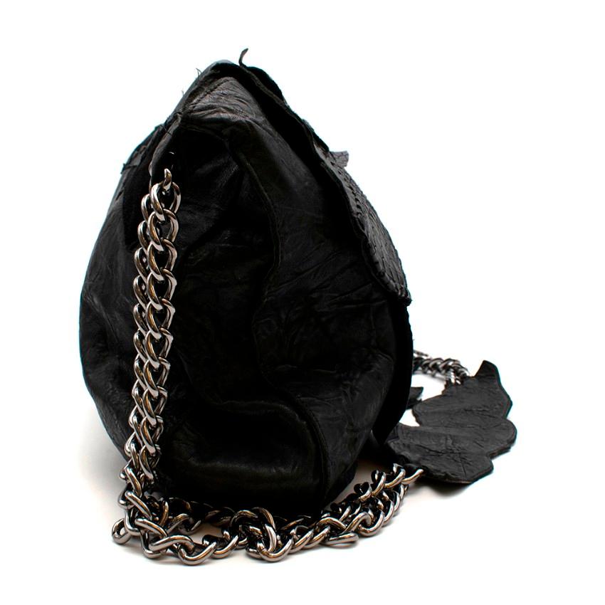 Balmain Crocodile Black Patchwork Bag	

Detailed stitching on exterior of bag.
Chain detailed
embellishments on front of bag.
Suede and leather patchwork.
Heavy chain strap with leather strap detail.
Large compartment with a separate side zip