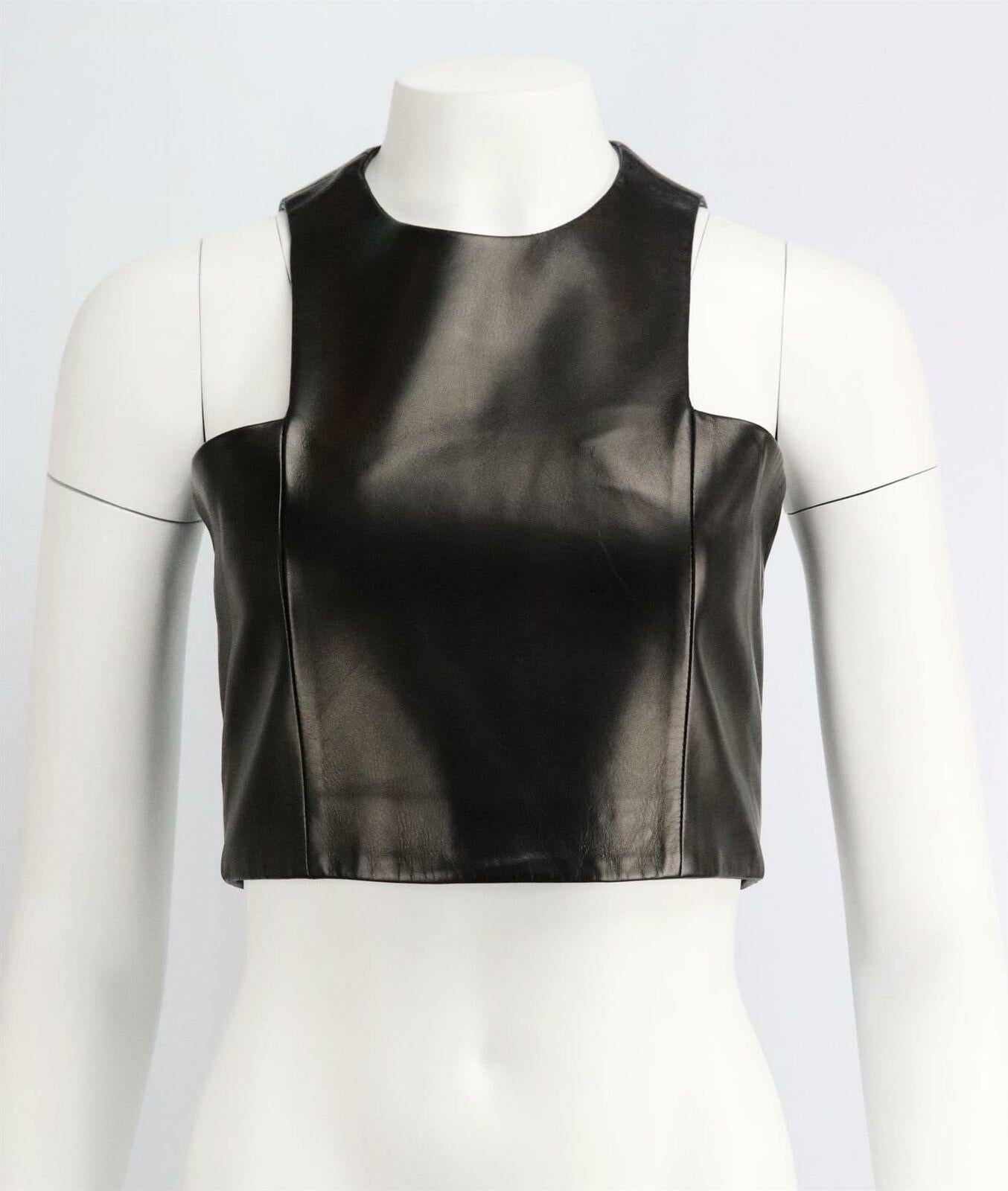 This smooth leather top by Balmain flatters and defines your shoulders, it's cut to sit flush against the body, this structured piece is lined in smooth satin for total comfort.
Black leather.
Zip fastening at back.
100% Leather (lamb); lining: 52%