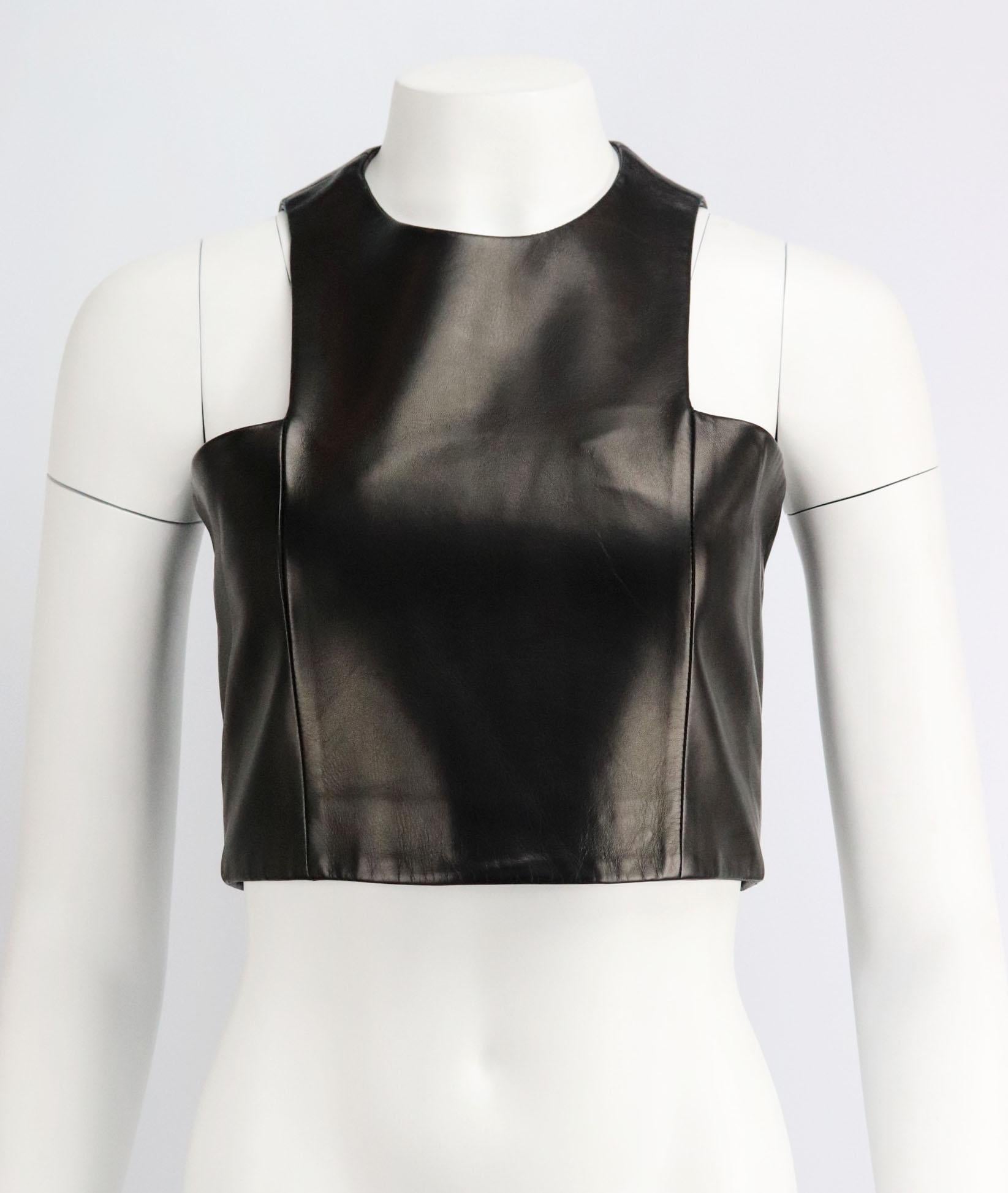 This smooth leather top by Balmain flatters and defines your shoulders, it’s cut to sit flush against the body, this structured piece is lined in smooth satin for total comfort. 
Black leather. 
Zip fastening at back. 
100% Leather (lamb); lining: