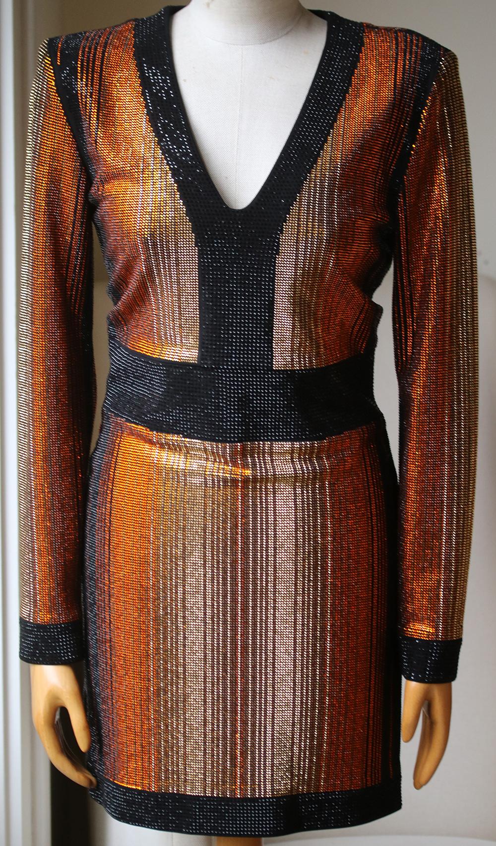 The long sleeves, padded shoulders and bodycon silhouette of this Balmain dress are all signatures of the brand's unique A-list aesthetic. Designed with minimal stretch to smooth and shape the body, the dress is covered in orange, gold and black