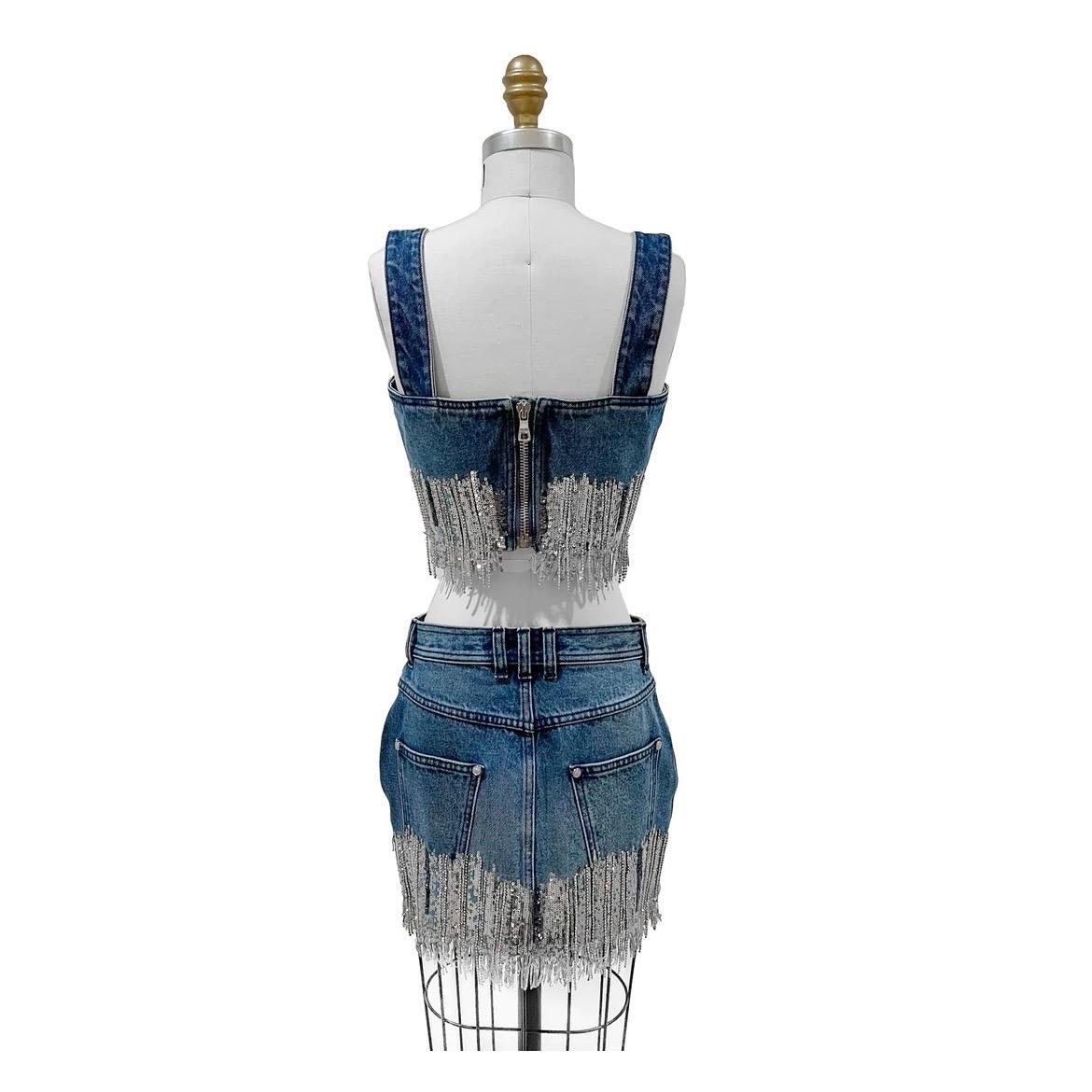 Denim Silver Sequin Fringe Mini Skirt Set by Balmain
Resort 2020
Made in Italy
Denim two piece
Silver sequin and crystal fringe embellishment 
Crop top has large back zip closure
Silvertone hardware
Sleeveless
Mini skirt has dual front and back