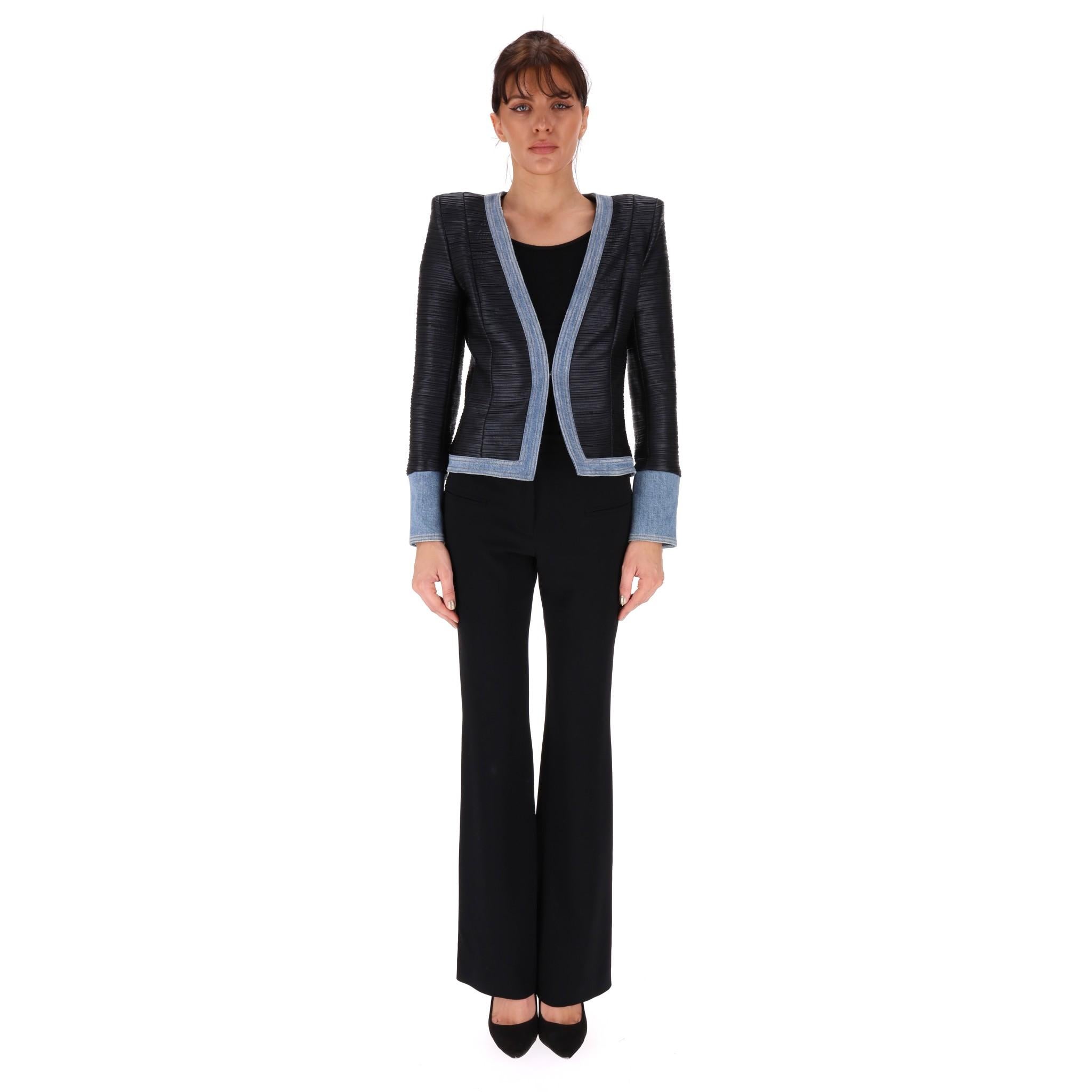 Balmain Denim-Trimmed Blazer/Jacket

Black, panel-textured blazer with light denim trims and signature embossed silver buttoned cuffs.

Padded shoulders, fitted silhouette and hook centre closure.

Rrp Approx. £2,000

Size – 34FR

Condition – Very