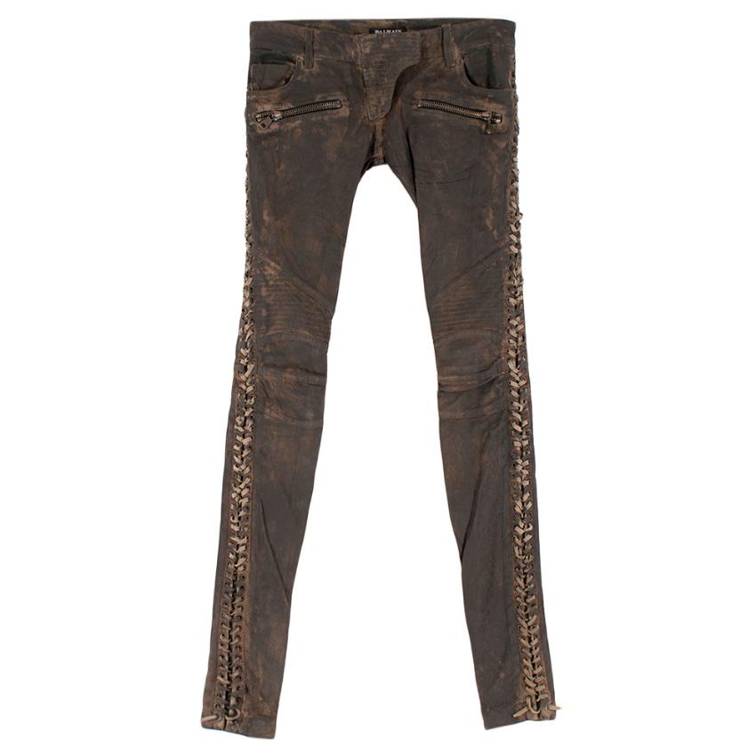 Balmain Brown Leather lace up Side Trousers

- Front Side Zip up Pockets 
- Lace-Up Sides 
- Distressed Leather 
- Clasp and Zip Top Fastening 
- Low Waisted 
- Zip-Up Cuffs 
- Skinny Fit 

100% Leather
Measurements are taken laying flat, seam to