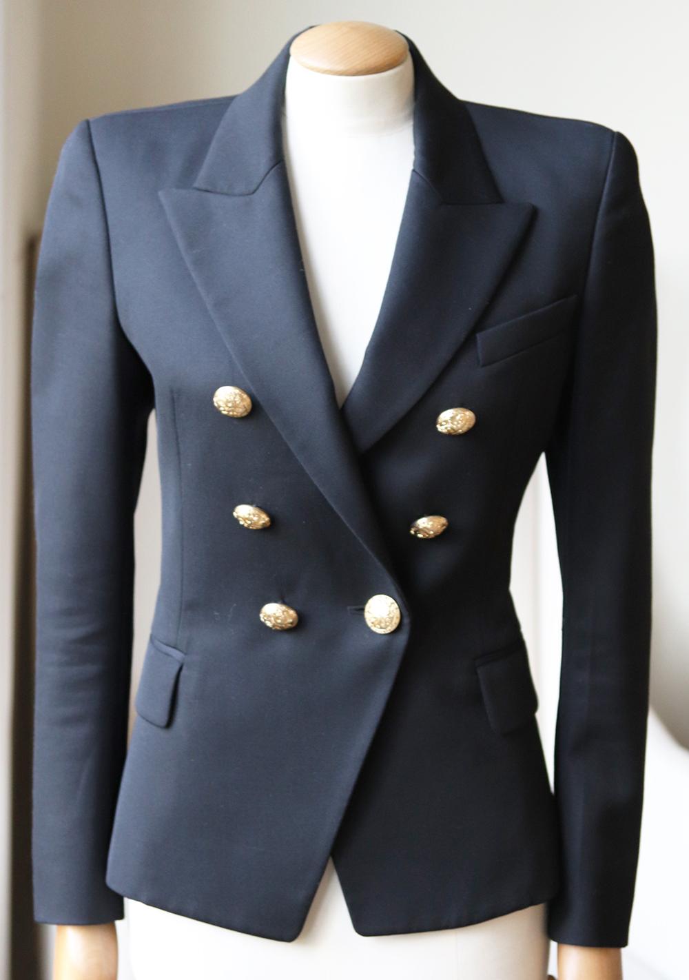 Balmain's sharply tailored blazer has snake-embossed gold buttons that emphasize the narrow structure of the jacket.
It's cut for a slim fit from mid-weight wool-twill and lined for easy layering.
Black wool-twill.
Button fastening through