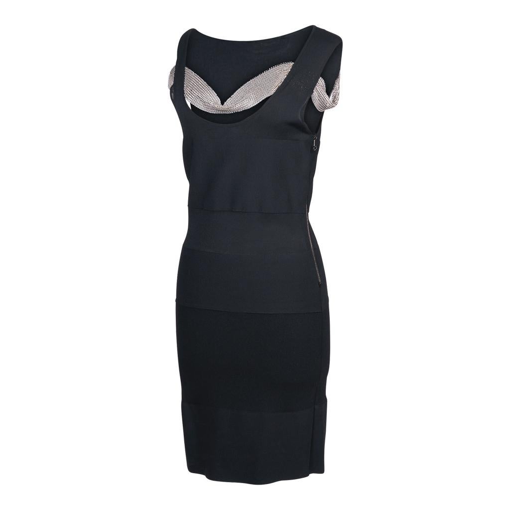 Guaranteed authentic Balmain sleeveless black knit dress with a low scoop neck.
Varying bands of knit create a unique bandage effect. 
Some of the bands are semi sheer. 
2