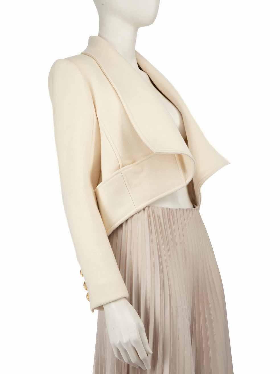 CONDIZIONE: molto buona. La giacca non presenta quasi nessun segno di usura visibile su questo articolo usato di Balmain.
  
  
  
  Dettagli
  
  
  Ecrù
  
  Lana
  
  Giacca
  
  Maniche lunghe
  
  Polsini con bottone
  
  Fronte aperto
  
 