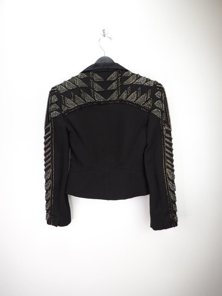 Custom made Balmain embroidered bolero blazer. Black with silver and gold sequins, material consists of 100% wool. 

COLOR: Black
MATERIAL: 100% wool. OUTER - 50% Viscose, 50% Cotton lining.
SIZE: 36
CONDITION: Excellent - used for photoshoots,