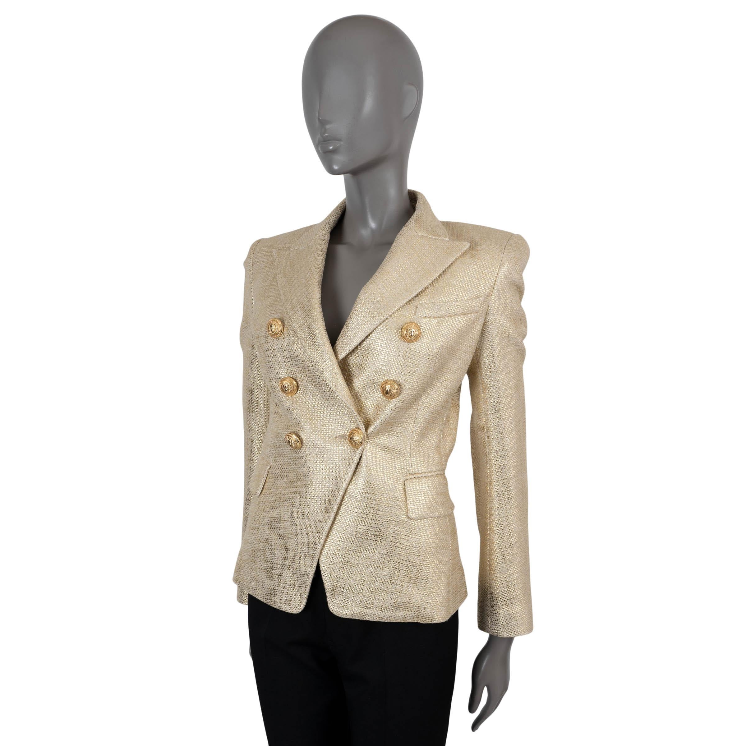 100% authentic Balmain signature double-breasted tweed blazer in metallic gold and beige cotton (100%). Features a tailored silhouette, peak lapels and two flap pockets at the waist. Closes with a gold-tone lion head buttons and is lined in viscose
