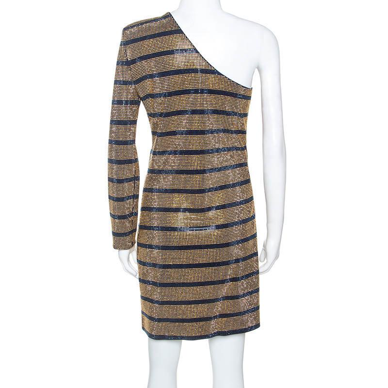 Make a unique style statement when you go out wearing this fashionable Balmain dress. This gold outfit has a relaxing fit and a glamorous look to light your style. Made from quality fabrics, this dress has a one-shoulder cut and crystals embellished