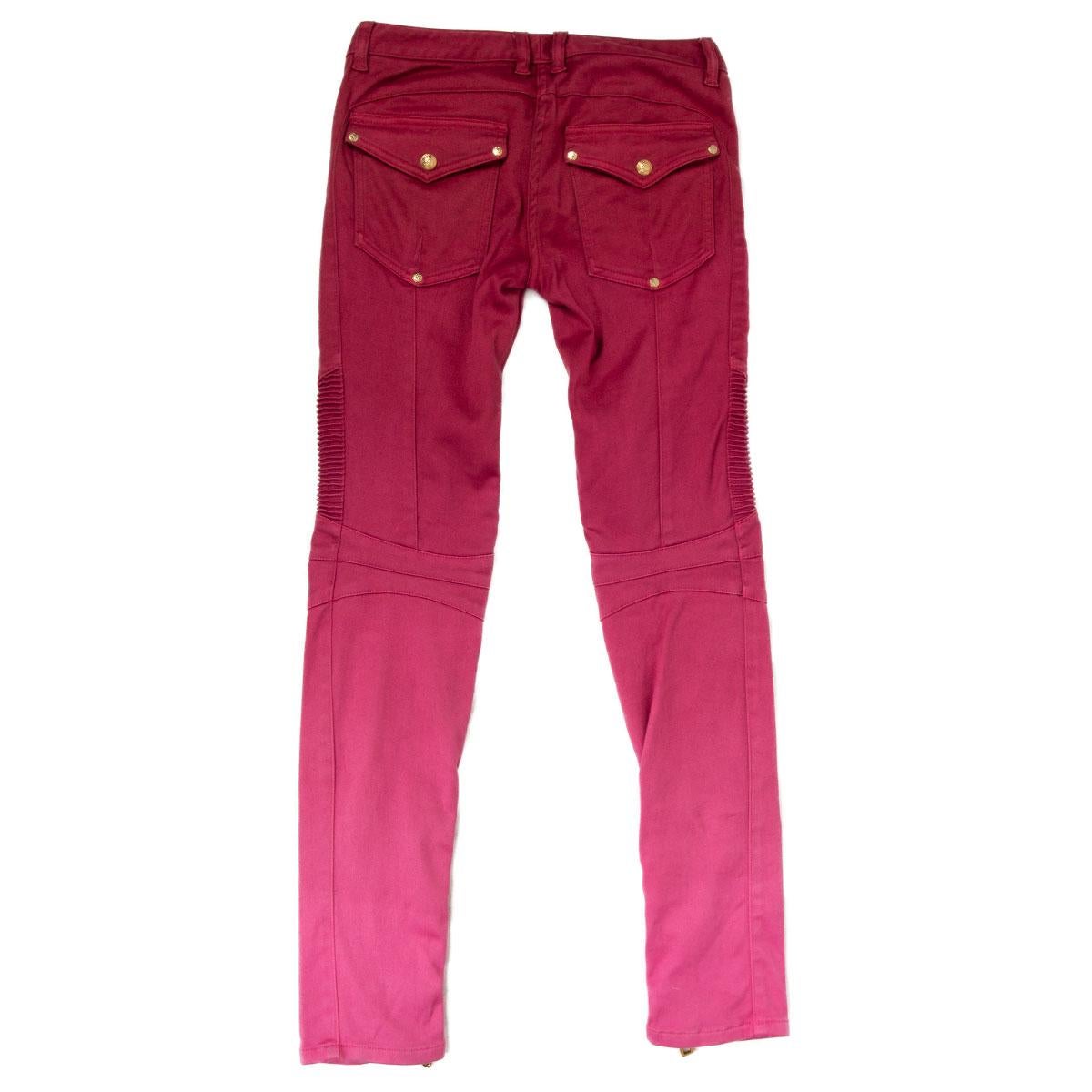 100% authentic Balmain gradient biker pants in pink to dark pink cotton (98%) and elastane (2%) with gold-tone zipper at the bottom-hem and two gold-tone buttoned- flap pockets on the back. Closes with one gold-tone button and a concealed zipper on