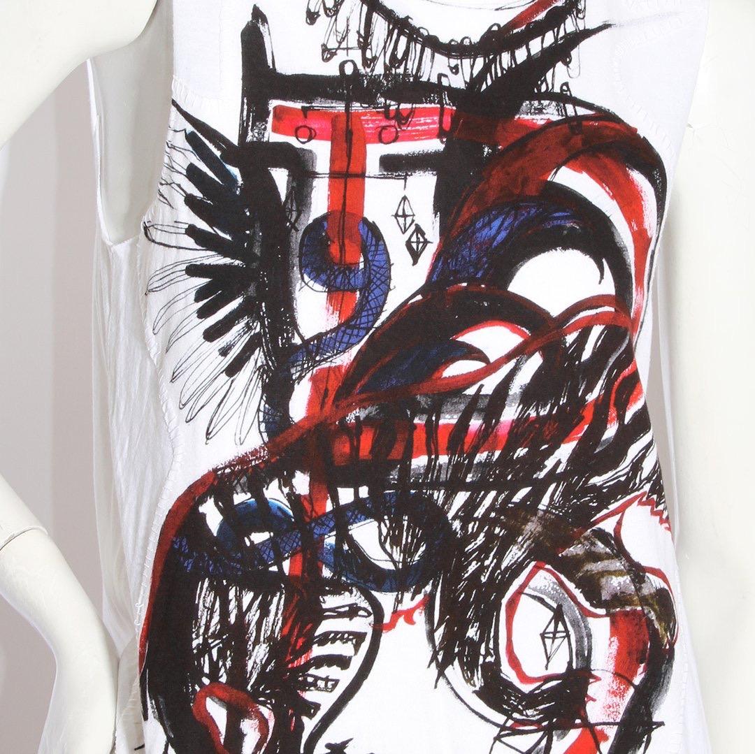 Graffiti tank by Balmain 
Mens spring 2011
White tank
Graffiti motif 
Black/red/blue graffiti colors 
Sleeveless tank 
Topstitching 
100% cotton
Made in Italy
Condition: Excellent, little to no visible wear. (see photos) 

Size/Measurements: