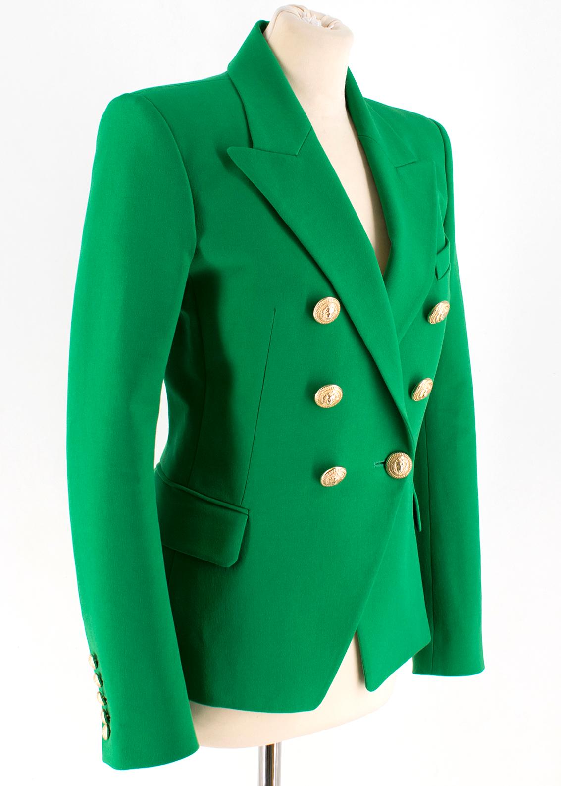 Balmain Green Double-Breasted Blazer

- Oversized gold buttons
- Peaked lapels
- Double breasted button closure
- Button cuffs
- Gold colored buttons with lion and chain pattern
- Padded shoulders
- One breast pocket
- Two side flap pockets
- Lining