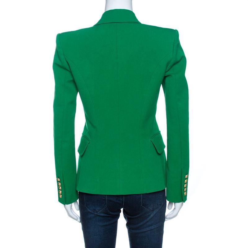 Balmain is known for its structured silhouettes and exquisite craftsmanship. This double-breasted jacket is no different. Crafted from cotton, modal and other quality materials, it flaunts a lovely shade of green. It is designed to deliver ultimate