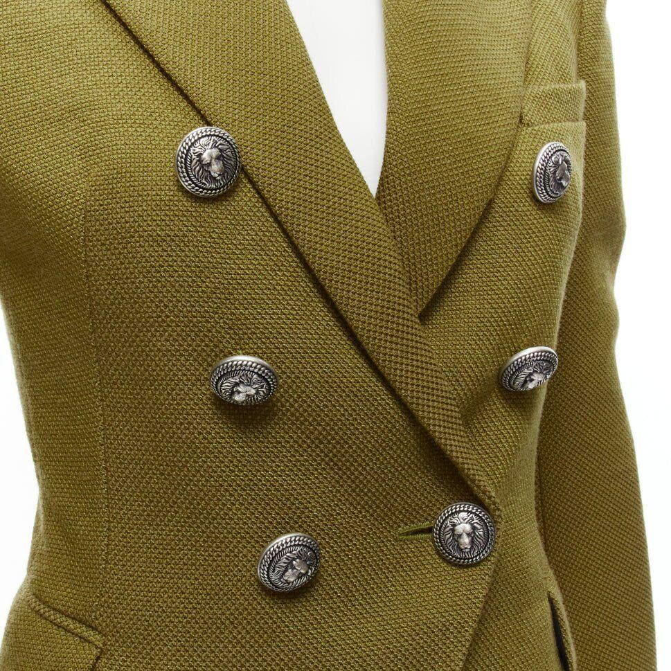 BALMAIN green silver lion button double breasted military blazer jacket FR36 S
Reference: TGAS/D00733
Brand: Balmain
Designer: Olivier Rousteing
Material: Polyamide, Blend
Color: Green
Pattern: Solid
Closure: Button
Lining: Black Fabric
Extra