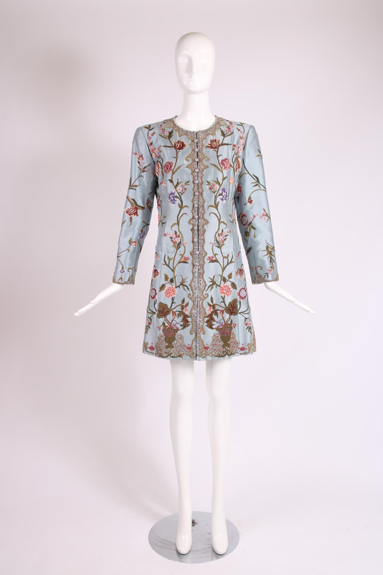 Balmain haute couture light blue silk oversized jacket with floral themed embroidery throughout, faux fabric-covered buttons down center front which hide interior hook and eye closures and interior with silk taffeta lining from the bust to the hem.