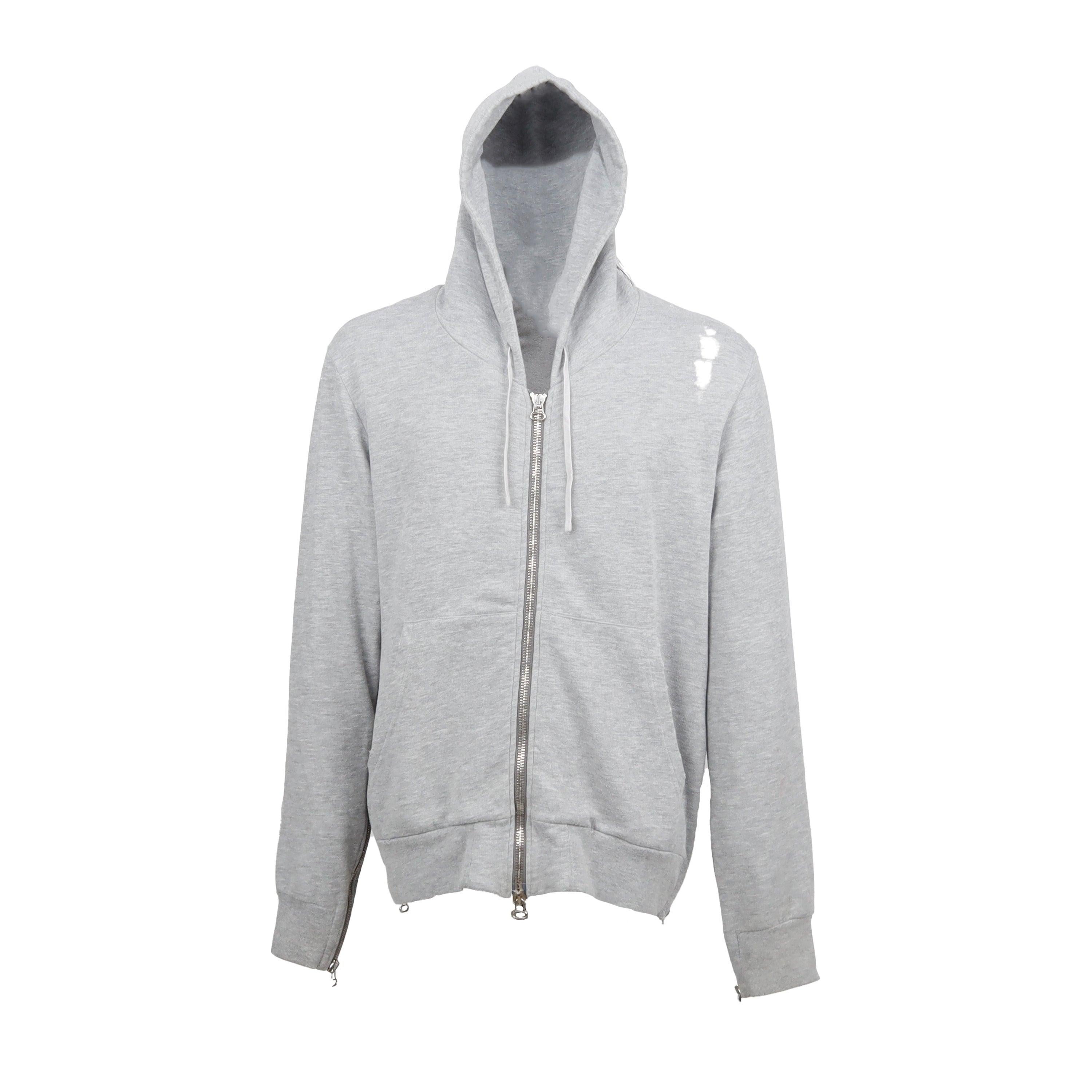 This Balmain Hooded Sweatshirt with Holes is perfect for a casual, urban look. It's made from a blend of cotton and polyester for comfort, and has a cool, distressed look with holes. The light grey color and silver tone front zipper and side zippers