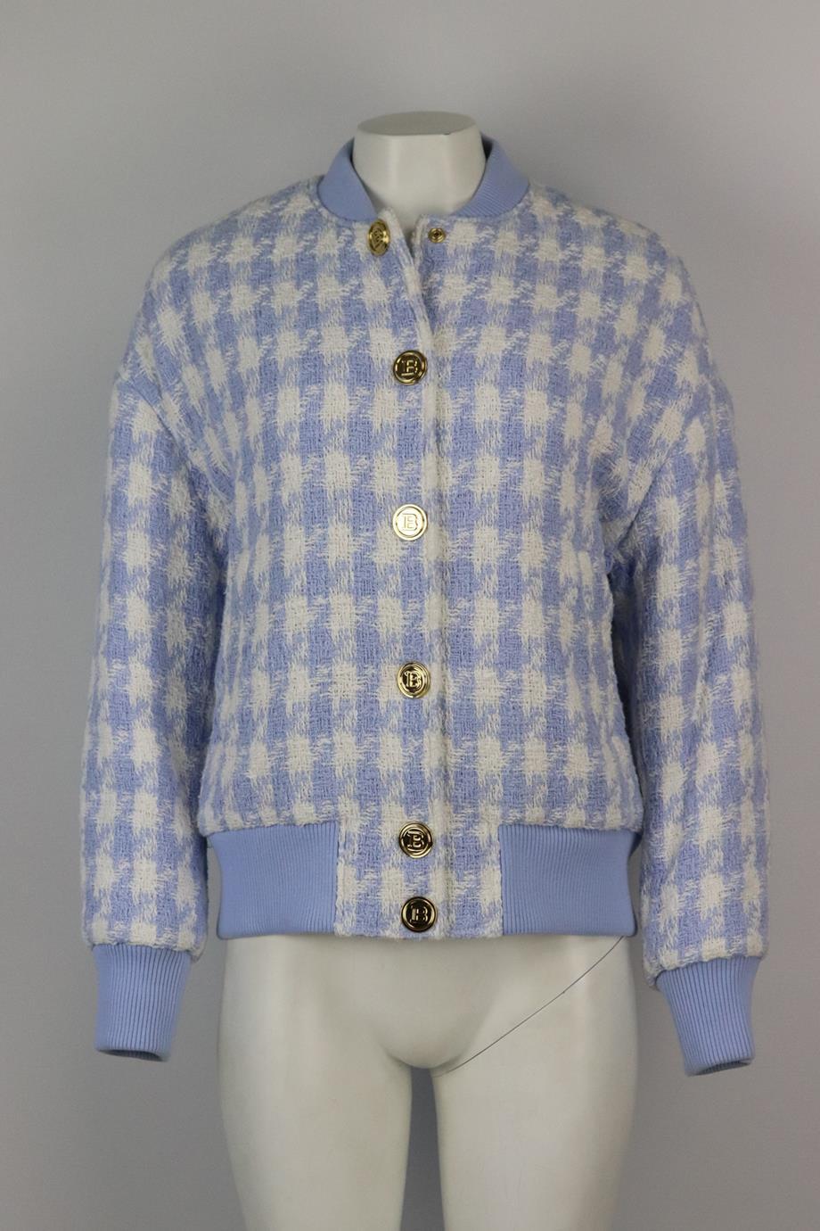 Balmain houndstooth cotton blend tweed bomber jacket. Blue and white. Long sleeve, crewneck. Snap button fastening at front. 92% Cotton, 7% polyester, 1% other fibres; body lining: 52% viscose, 48% cotton; sleeve lining: 52% viscose, 48% cotton;