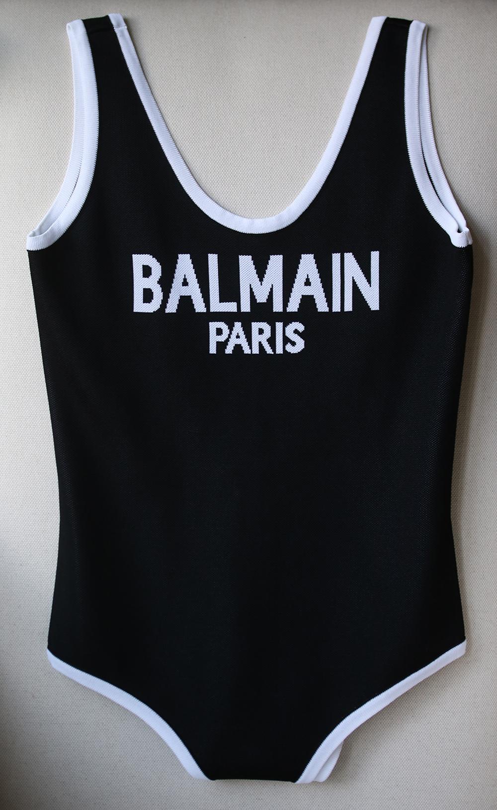 Combining logomania and athleisure, this Balmain bodysuit ticks all the right trend boxes. It's been knitted in France with an intarsia logo and deep scooped back. The snap fastening-base ensures it layers smoothly under skirts and pants - it was