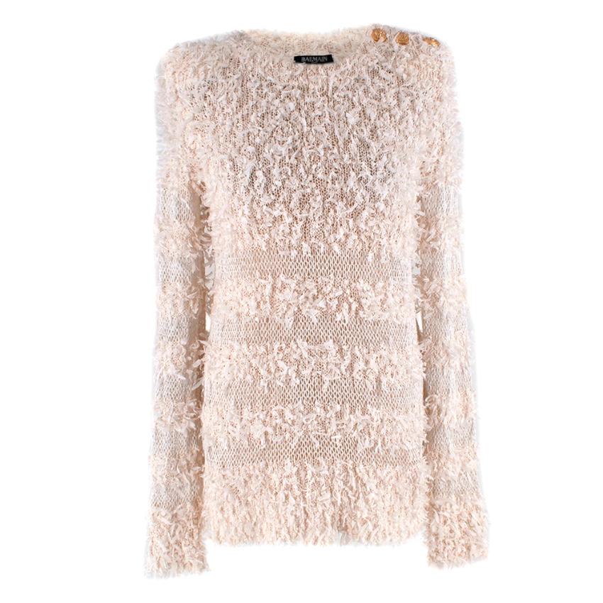 Balmain Ivory Cotton Blent Textured Knit Top

-Soft cotton blend knit  texture 
-Gorgeous gold tone lion buttons to the shoulder 
-Beautiful boucle texture 
-Round neckline 
-Sheer silver thread embellished striped panels 
-Classic long sleeve cut