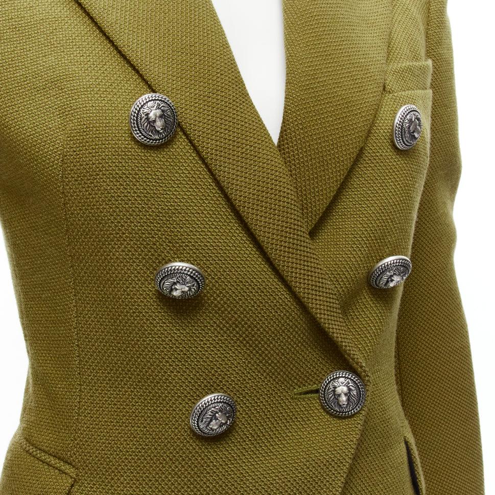 BALMAIN green silver lion button flap pockets double breast military blazer jacket FR38 M
Reference: TGAS/D00733
Brand: Balmain
Designer: Olivier Rousteing
Material: Polyamide, Blend
Color: Green
Pattern: Solid
Closure: Button
Lining: Black