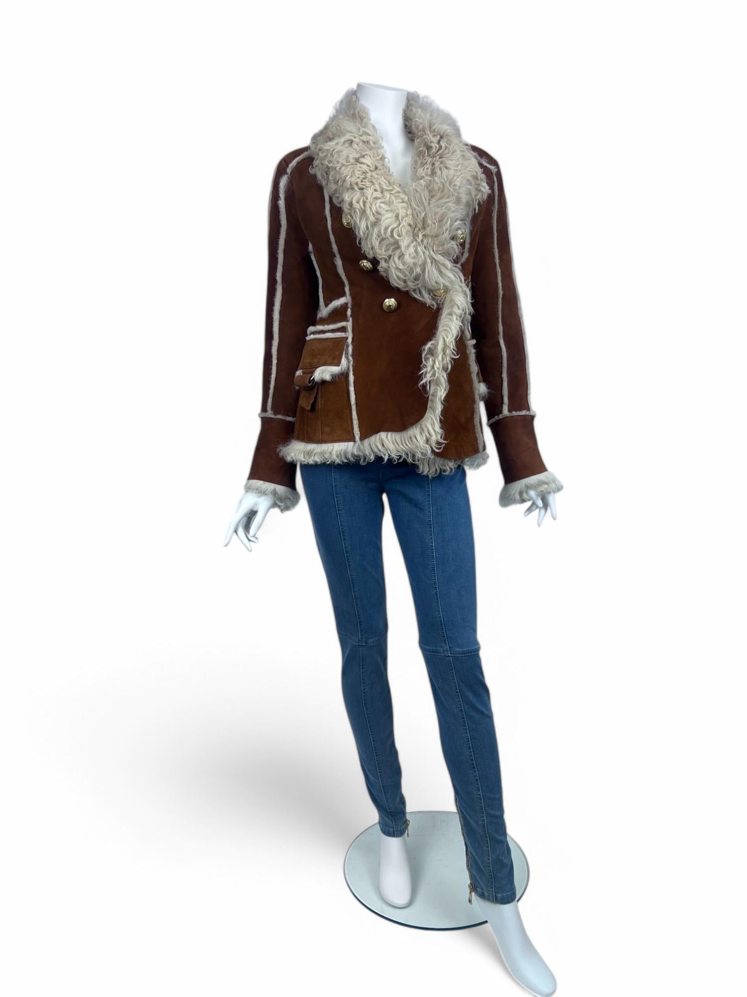 A statement of luxury and sophistication, this Balmain Shearling Jacket embodies the brand’s signature structured elegance with a refined, cozy twist. Crafted from plush, high-quality shearling, the jacket offers both warmth and a sleek, tailored