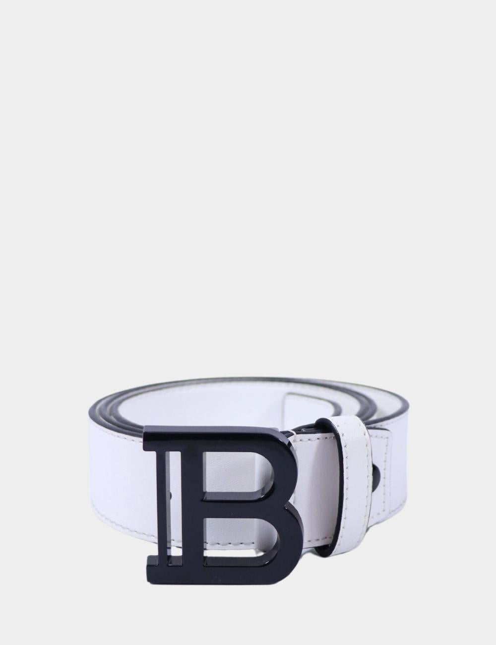 Bold, sleek, and unmistakably iconic—the Balmain white leather belt with a black 