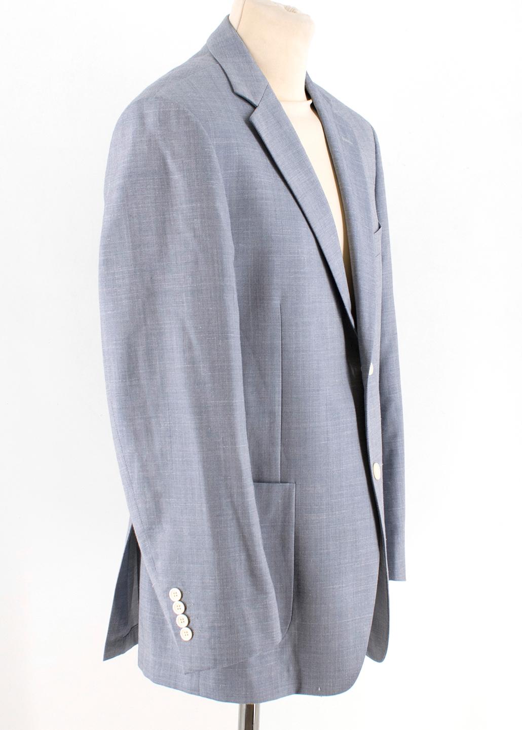 Balmain Men's Blue Wool Blend Blazer 

Single breasted wool blend jacket, with white buttons,
Padded shoulders, 
Standard notch lapel, 
White button up cuffs,
Front centre chest pocket, 
Two front pockets, 
Double back vent, 
Three interior