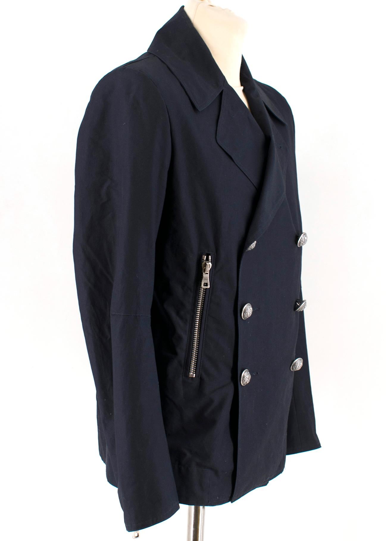 Balmain Men's Navy Double Breasted Peacoat

- Navy blue cotton coat 
- Double-breasted button fastening
- Two zippered pockets 
- Embossed silver-tone buttons
- Silver-tone zips
- Lightly padded shoulders
- Unlined

Please note, these items are