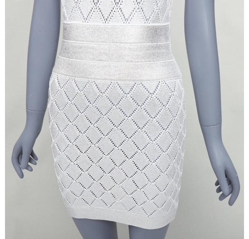 BALMAIN metallic silver coated cream argyle knit mini dress FR34 XS
Reference: YIKK/A00174
Brand: Balmain
Designer: Olivier Rousteing
Material: Viscose
Color: Silver, Cream
Pattern: Solid
Closure: Zip
Extra Details: Exposed back zip.
Made in:
