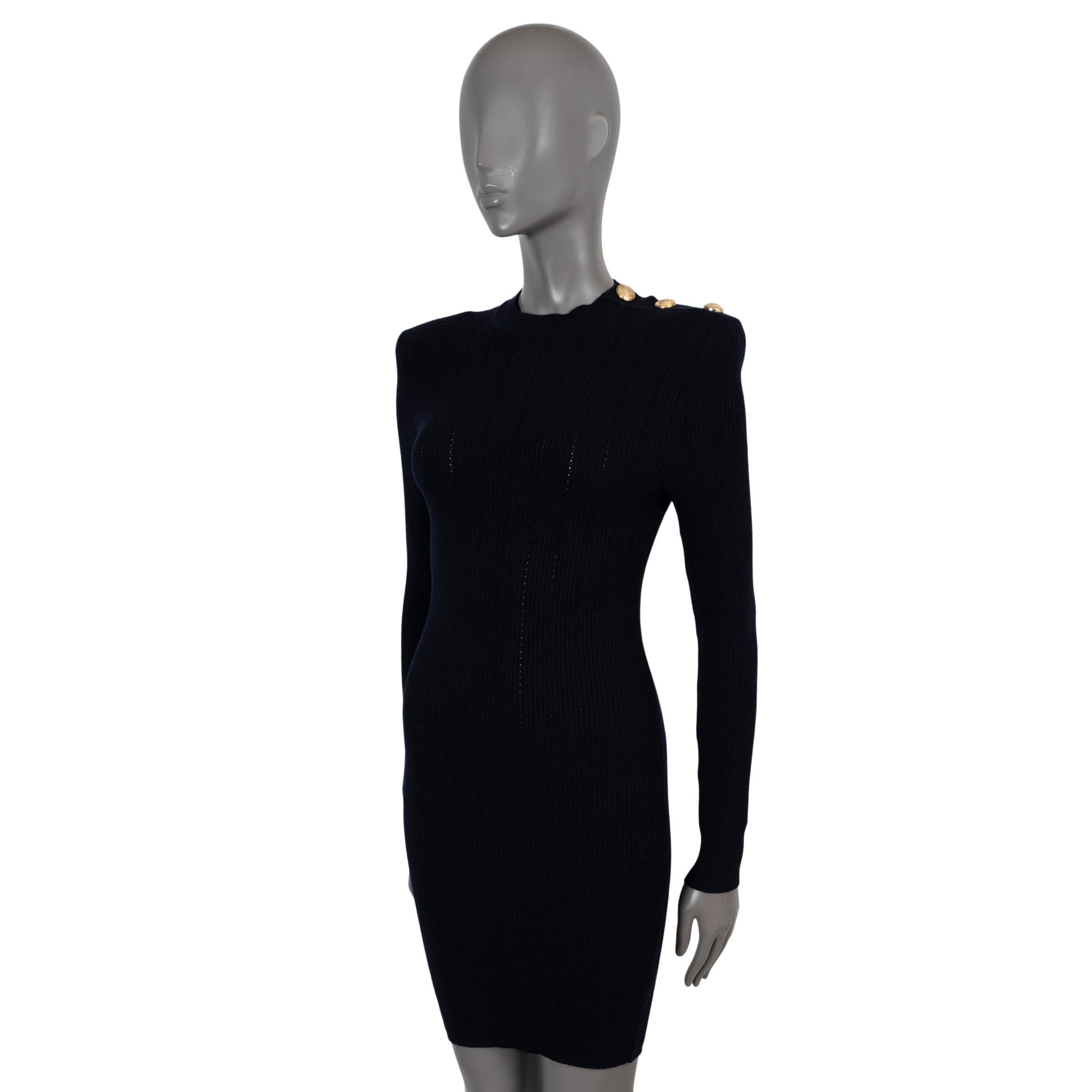 100% authentic Balmain bodycon knit dress in midnight blue rib-knit wool (with 6% polyester). Features signature structured shoulders, long sleeves, crewneck and pointelle stripes. Opens with gold-tone buttons at the neck and is unlined. Has been