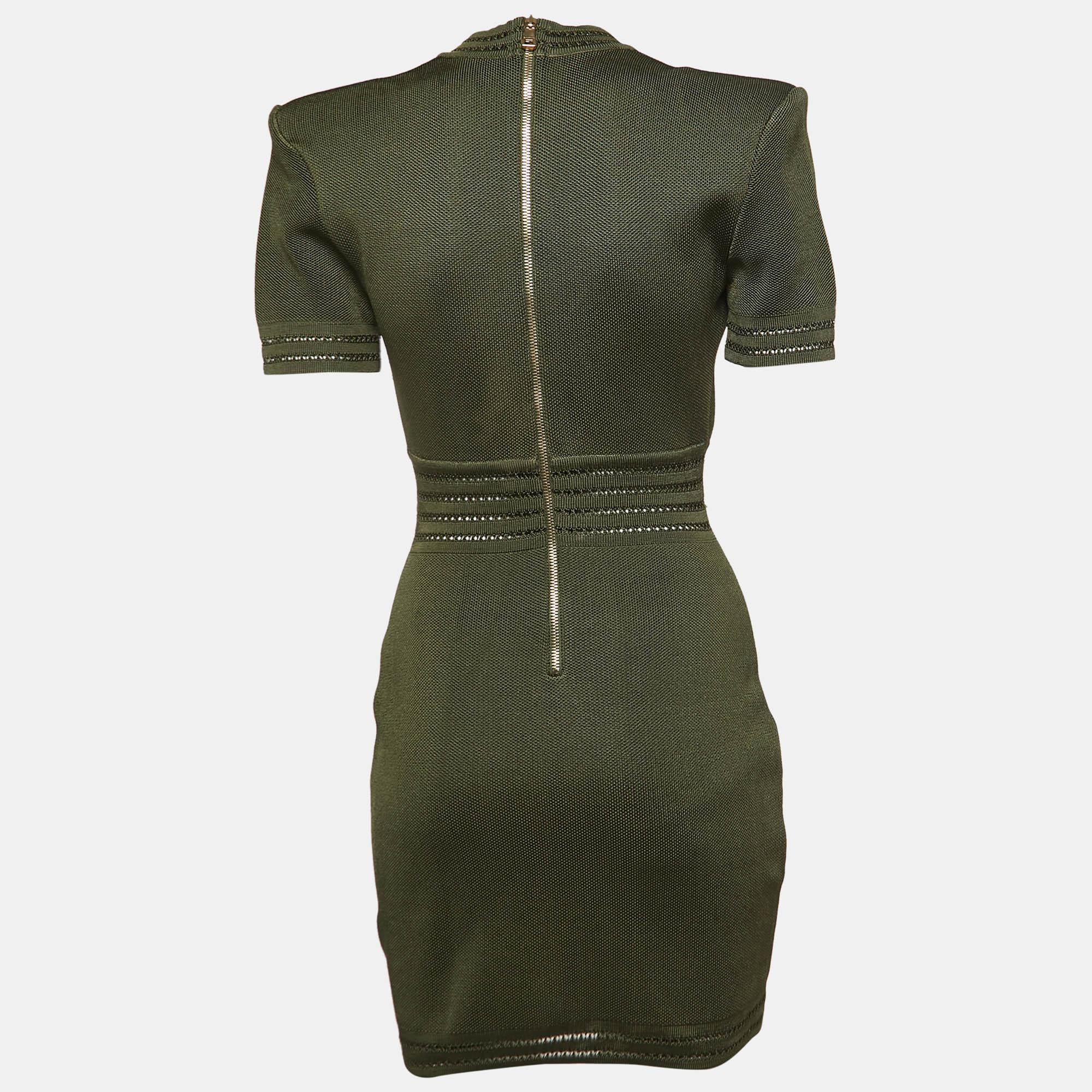 Make a luxe fashion statement by wearing this Balmain military green mini dress. It is sewn using knit fabric into a flattering silhouette.

