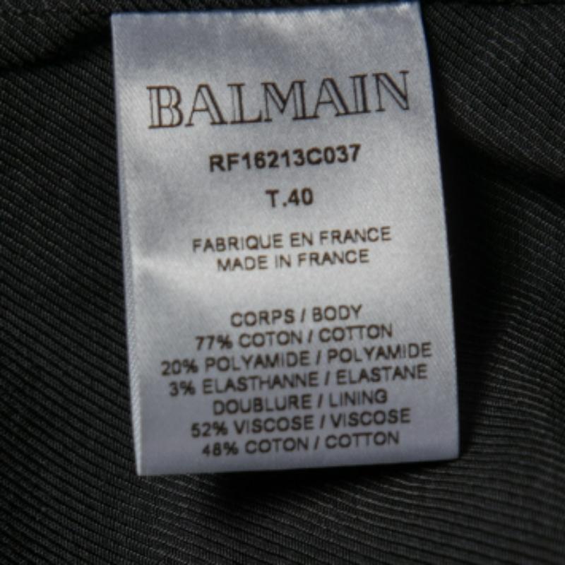 Aggiungi al tuo armadio questo mini abito classico con stampa pied-de-poule di Balmain e otterrai solo complimenti. È realizzato su misura in una silhouette strutturata con tessuto jacquard e presenta maniche lunghe e dettagli con bottoni dorati.