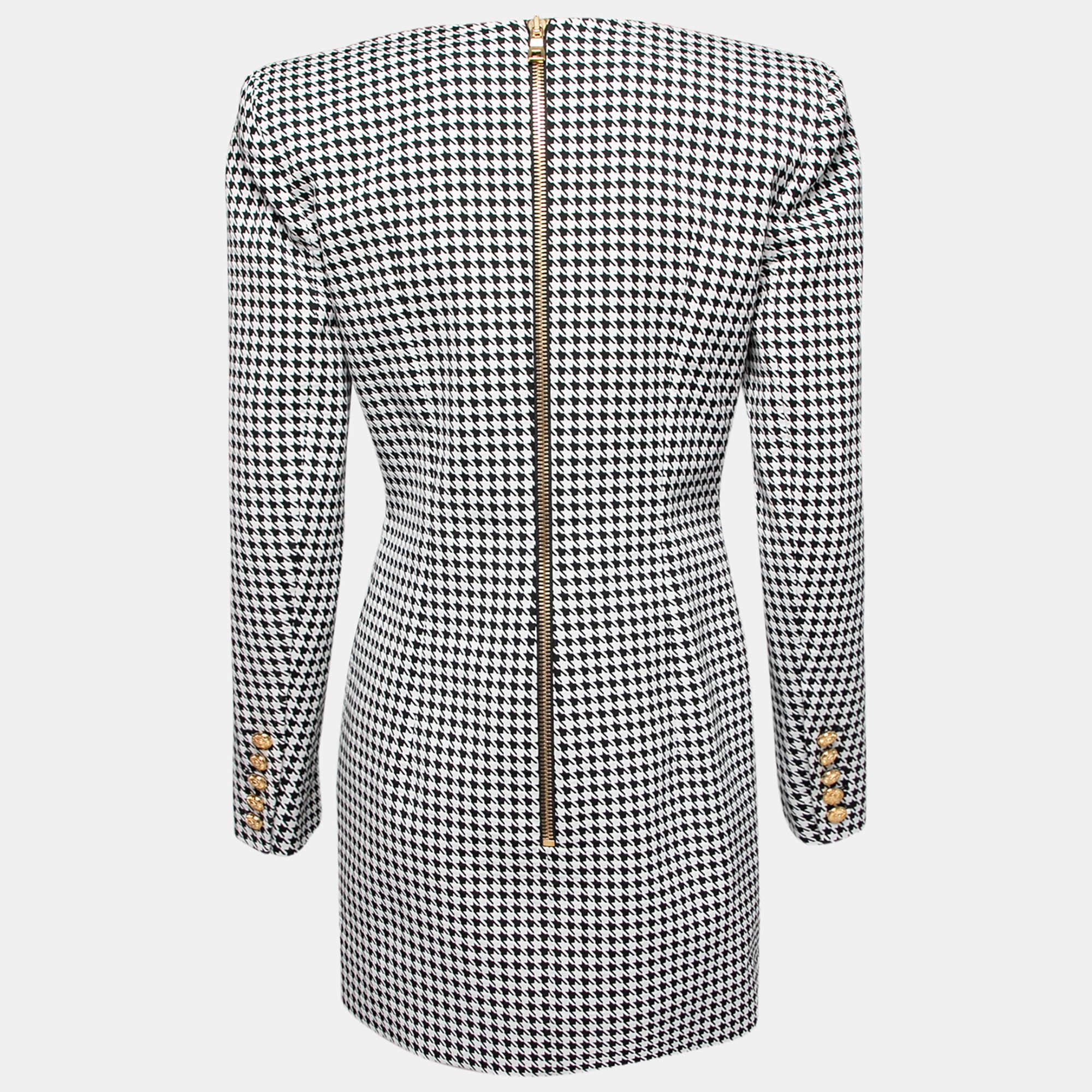 Add this classic, houndstooth print mini dress from Balmain to your closet and fetch nothing but praise. It is tailored into a structured silhouette using jacquard fabric and features long sleeves as well as gold-tone button details. Pair it with