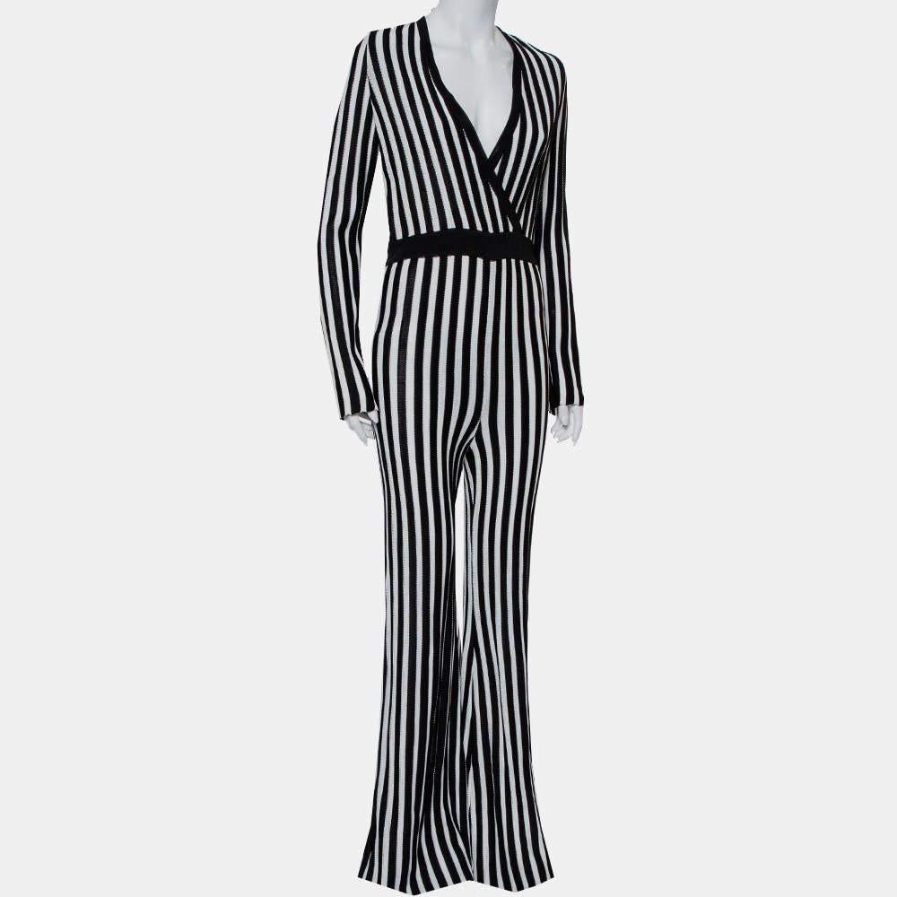 Dress up in this Balmain Jumpsuit to project a chic look. Featuring long sleeves, faux wrap detail, and a monochrome striped look, this impeccably tailored jumpsuit can be complemented with a Balmain blazer.


