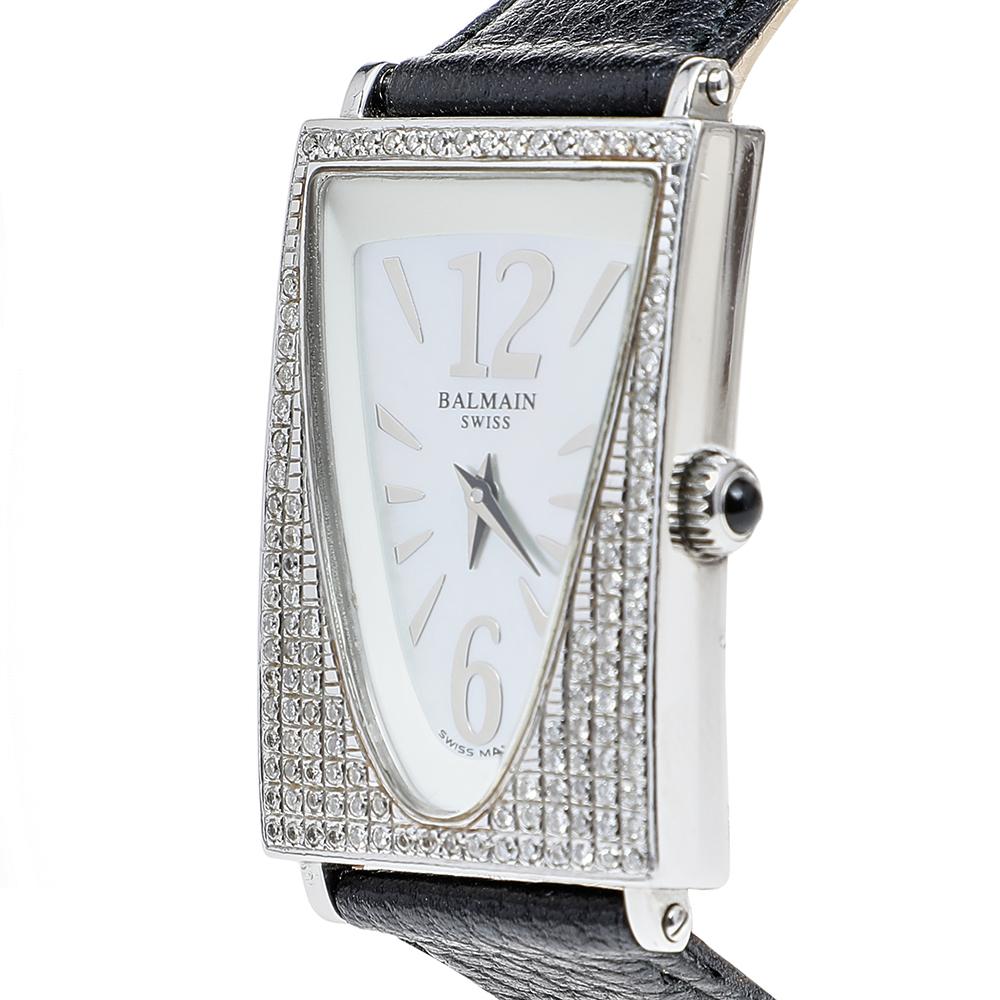 Balmain's Amphora watch is brilliantly designed with a stainless steel case. It features a stunning rectangular bezel, studded with aftermarket diamonds and a mother of pearl dial detailed with simple hour markers and two hands. It comes fitted with