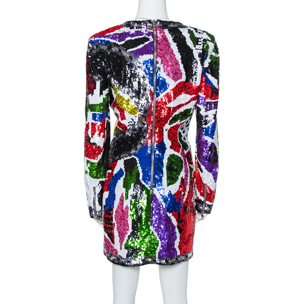 This gorgeous dress from Balmain is going to grab everyone's attention. The creation has intricately detailed sequins all over the dress that gives it a neo-classical look. It features long sleeves and a zipper fastening at the back. This colorful