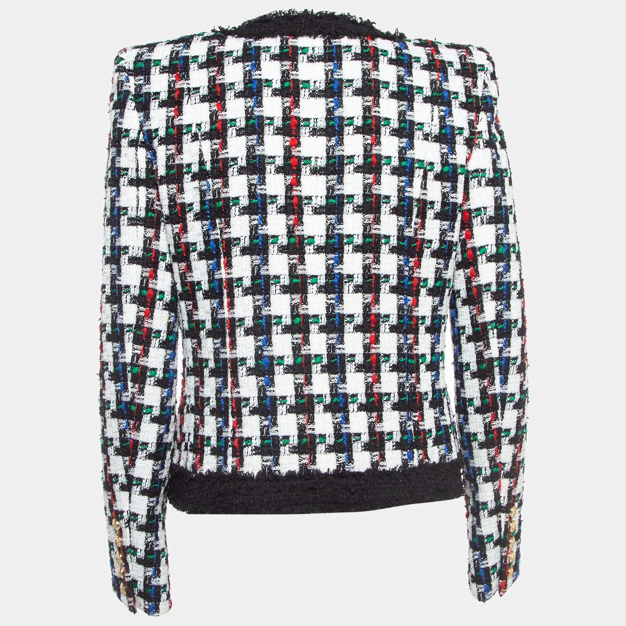 Prova il lusso in ogni cucitura con questa giacca in tweed di Balmain. Unendo arte e moda, è un pezzo che aggiunge un fascino imperdibile al tuo look, definendo il tuo stile unico.