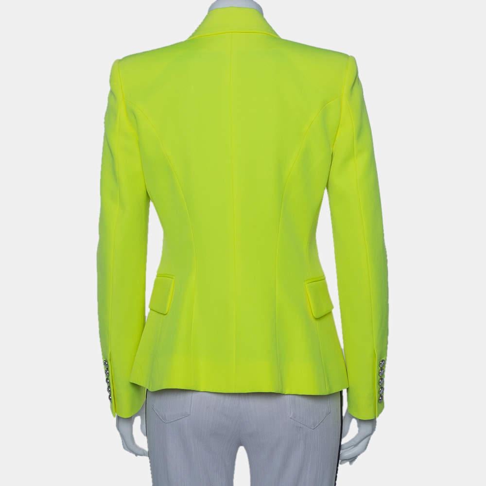 Grab attention by wearing this contemporary blazer from Balmain. This comfortable and stylish yellow blazer is designed in a double-breasted style with pockets and long sleeves. Use this appealing and posh creation to flaunt your stylish