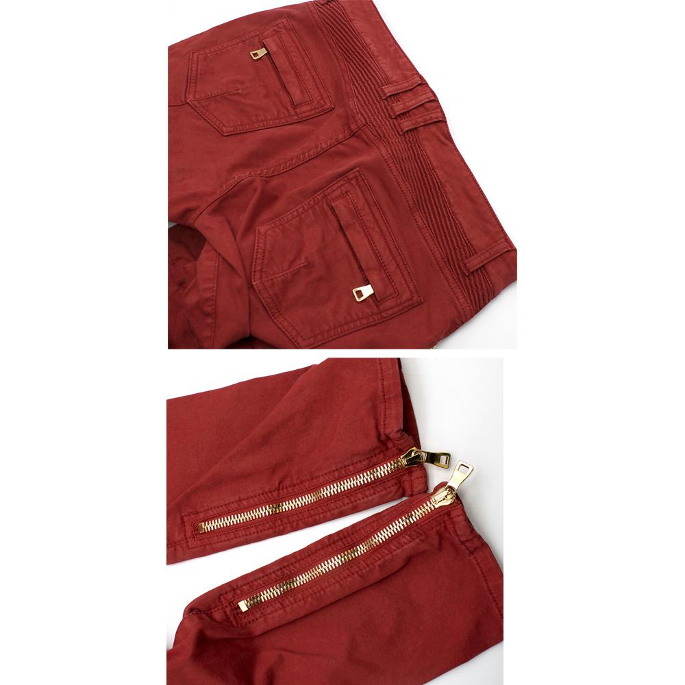 Balmain Paris Red Fitted Biker Jeans

- Slightly muted tone
- Fitted
- Gold hardware
- Zippers at ankle
- All zippers and pockets in good condition

Please note, these items are pre-owned and may show signs of being stored even when unworn and