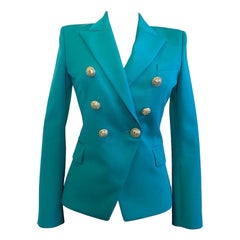 Balmain petrol green jacket with gold buttons.