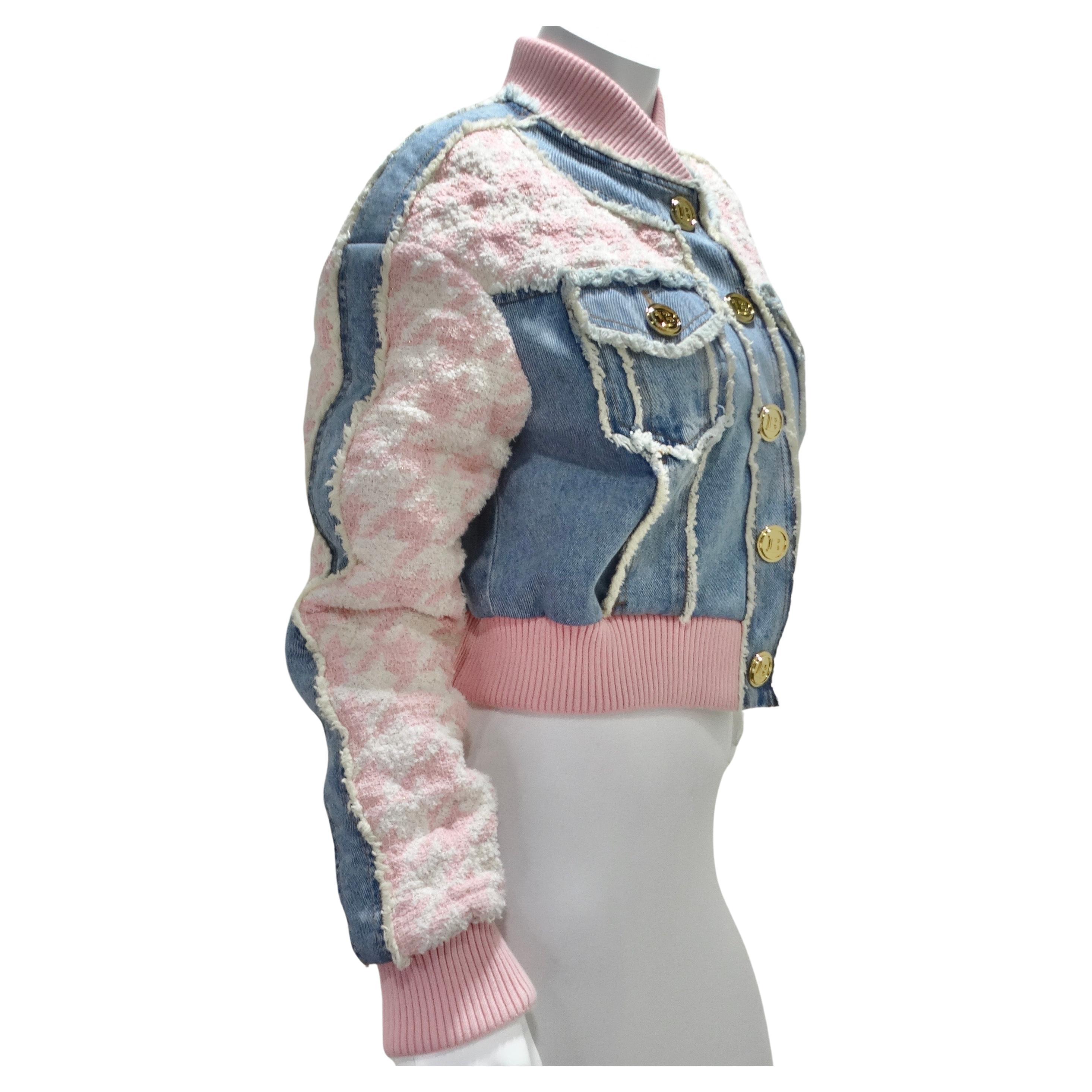 Get your hands on the Balmain Pink Tweed Denim Bomber Jacket – a striking blend of texture and design that effortlessly captures the essence of bold fashion. This bomber jacket is a visual masterpiece, contrasting pink and white houndstooth tweed