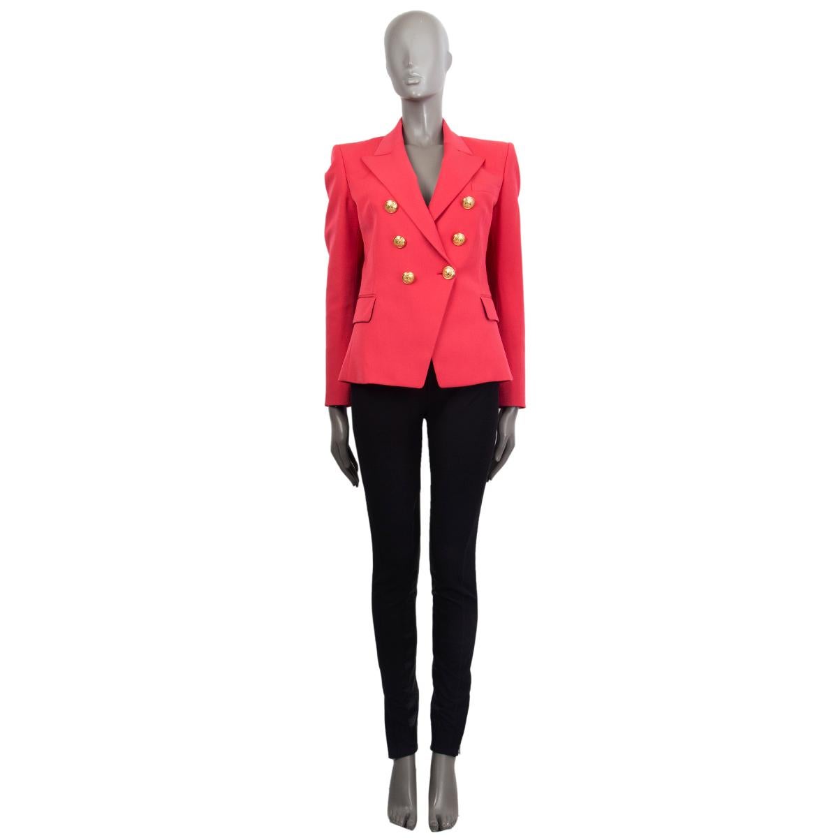 Balmain signature double-breasted blazer in watermelon wool (100%) with a slim-fitting silhouette, one patch pocket on the chest, two flap pockets and buttoned cuffs at the back. Closes with embosses logo gold-tone buttons in the front. Lined in