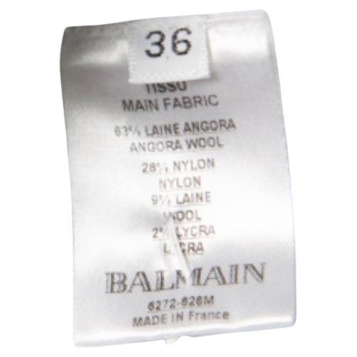 Strengthen your personality in the most glamorous manner by wearing this Balmain skirt. This powder blue skirt is made of an angora wool blend and features a flattering silhouette. It comes equipped with a gold-tone zip closure at the back and is
