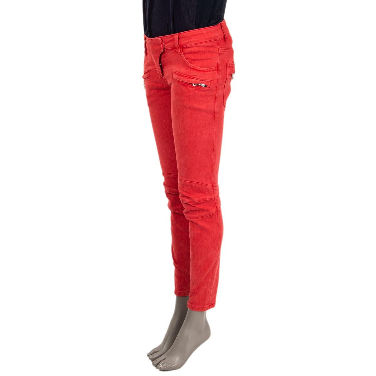 100% authentic Balmain skinny low-rise biker jeans in red cotton (98%) elastane (2%) with two slit and two zipper pockets on the front. Regular length and zippers along the leg inside. Have been worn and are in excellent condition.

Measurements
Tag