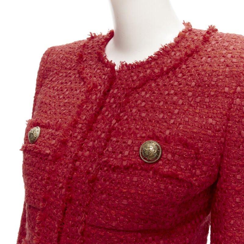 BALMAIN red tweed gold military button 4 pocket power blazer jacket FR34 XS
Reference: AAWC/A00337
Brand: Balmain
Designer: Olivier Rousteing
Material: Tweed
Color: Red, Gold
Pattern: Solid
Closure: Hook & Eye
Lining:  Fully Lined
Extra Details: